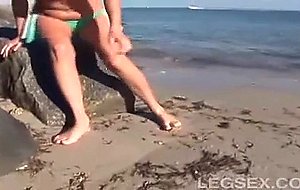 Jessica has sand between her toes