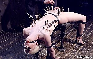 Blonde in device bondage ass hooked