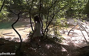 Strapped nude on a rope bridge in a canyon tour