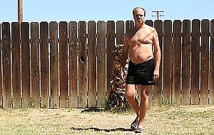 A daddy parading around naked in his backyard.